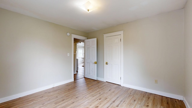 69 Androscoggin Ave, Lewiston, ME 04240 - unfurnished room featuring baseboards and light wood-style floors