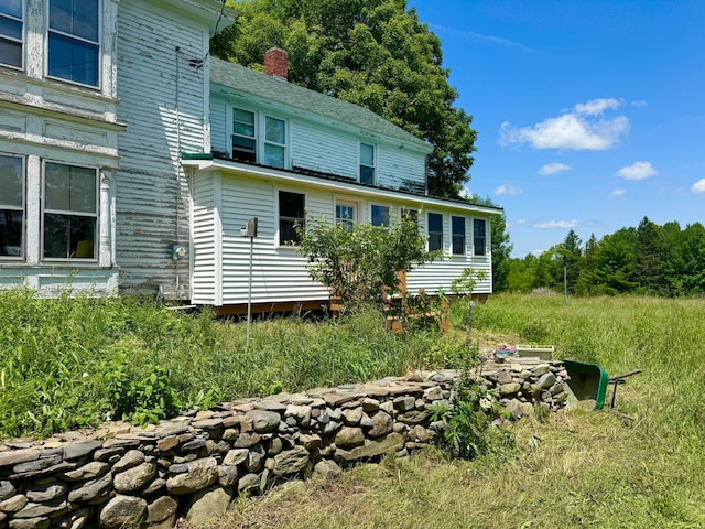 610 E Sangerville Rd, Sangerville, ME 04479 - rear view of house with a chimney