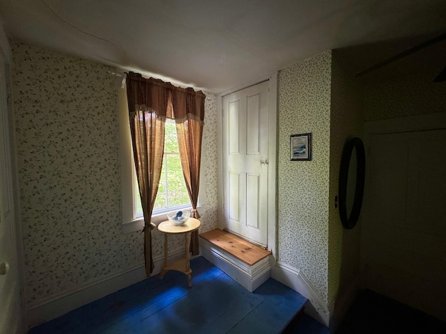 610 E Sangerville Rd, Sangerville, ME 04479 - living area with wallpapered walls and baseboards