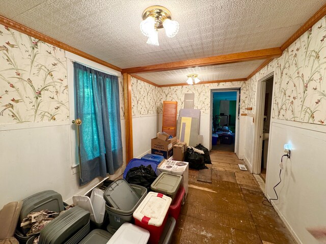 610 E Sangerville Rd, Sangerville, ME 04479 - miscellaneous room with wallpapered walls, wainscoting, and ornamental molding