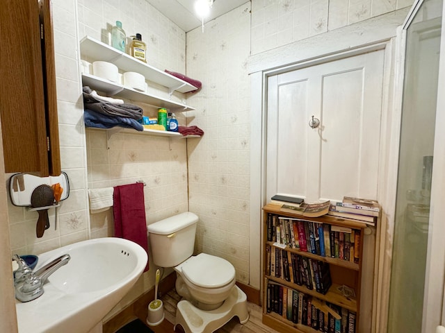 610 E Sangerville Rd, Sangerville, ME 04479 - bathroom featuring tile walls and a shower