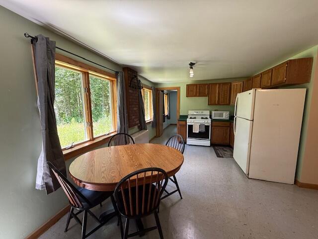47 Tranquility Ln, Perry, ME 04667 - dining area featuring baseboards and light floors
