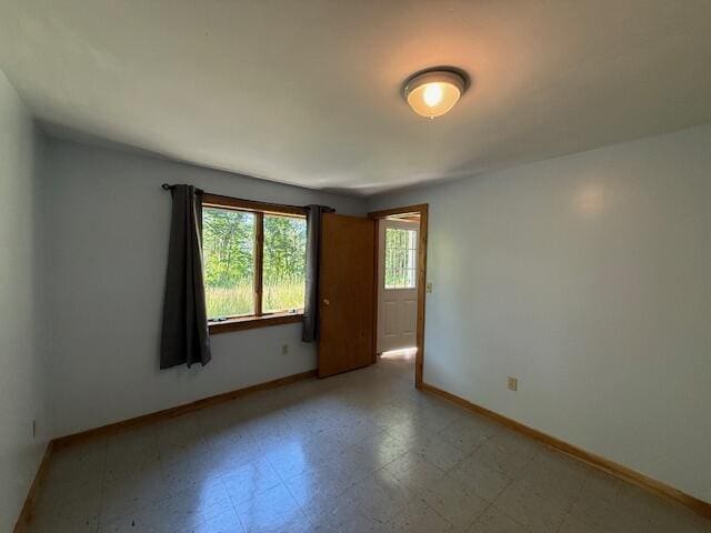 47 Tranquility Ln, Perry, ME 04667 - unfurnished room featuring baseboards and tile patterned floors