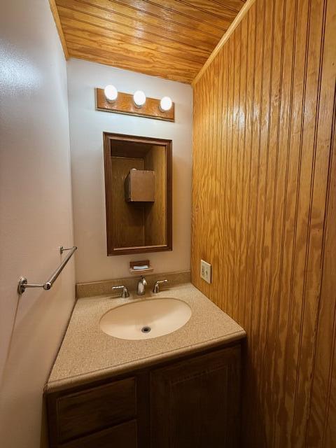 47 Tranquility Ln, Perry, ME 04667 - bathroom featuring wood ceiling and vanity