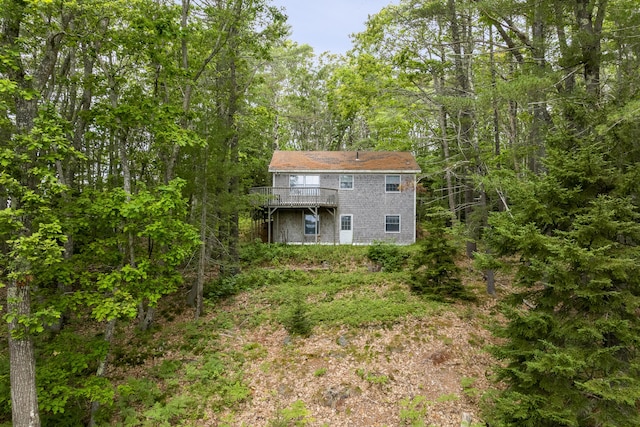124 Main Rd, Westport Island, ME 04578 - rear view of house with a wooden deck and a view of trees