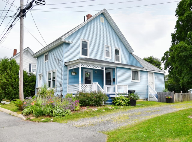 26 Elm St, Old Town, ME 04468 - view of front of property featuring a porch and a chimney
