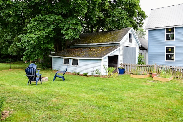 26 Elm St, Old Town, ME 04468 - view of yard with a vegetable garden and an outdoor structure