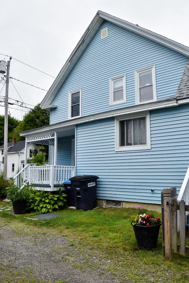 26 Elm St, Old Town, ME 04468 - rear view of property featuring covered porch