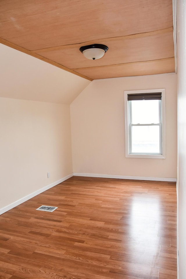 26 Elm St, Old Town, ME 04468 - spare room with vaulted ceiling and light wood finished floors