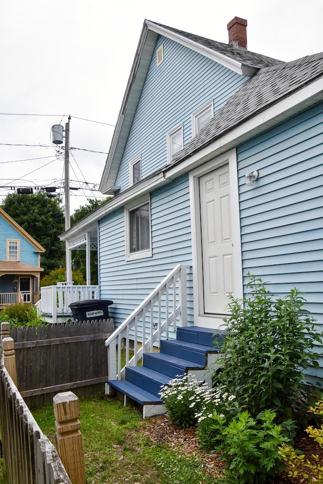26 Elm St, Old Town, ME 04468 - back of house with a chimney and a shingled roof