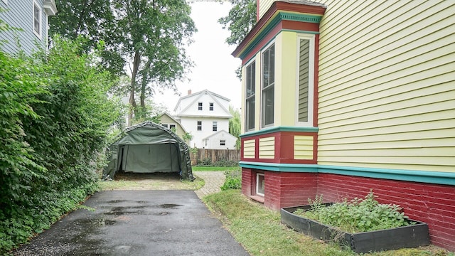 93 Fessenden St, Portland, ME 04103 - view of side of home with driveway and a detached carport