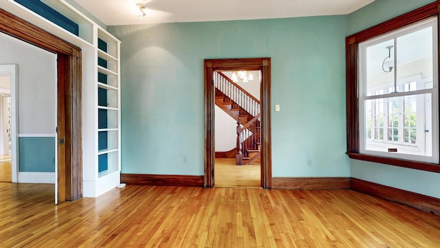 93 Fessenden St, Portland, ME 04103 - spare room featuring light wood-type flooring and stairway