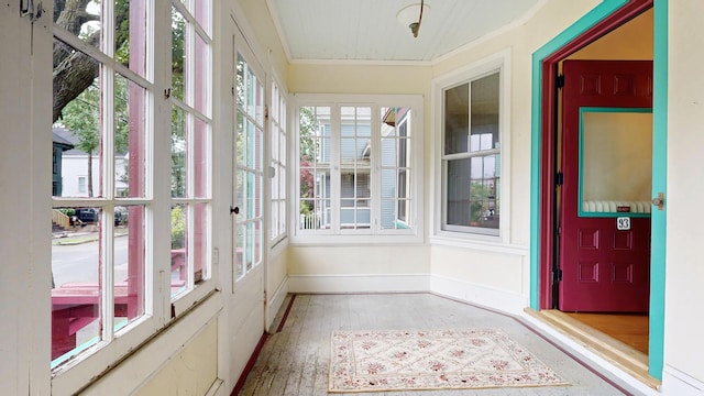 93 Fessenden St, Portland, ME 04103 - unfurnished sunroom featuring ornamental molding and wood finished floors