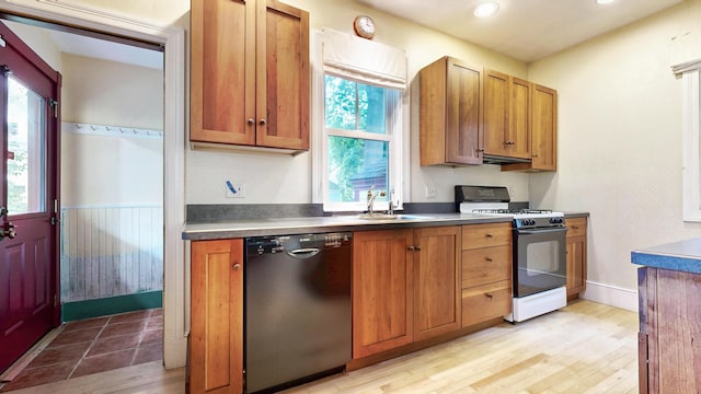 93 Fessenden St, Portland, ME 04103 - kitchen featuring dishwashing machine, range with gas cooktop, plenty of natural light, brown cabinets, and recessed lighting