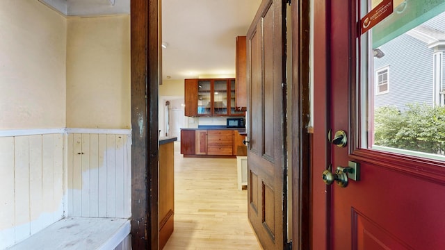 93 Fessenden St, Portland, ME 04103 - corridor featuring light wood-style flooring and wainscoting