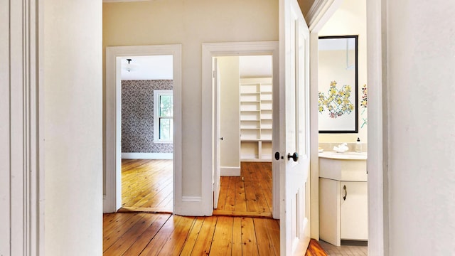 93 Fessenden St, Portland, ME 04103 - hallway featuring light wood finished floors and wallpapered walls