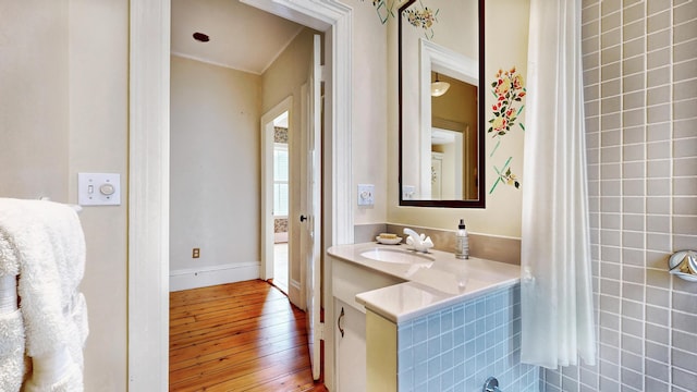 93 Fessenden St, Portland, ME 04103 - bathroom with hardwood / wood-style floors, vanity, and crown molding