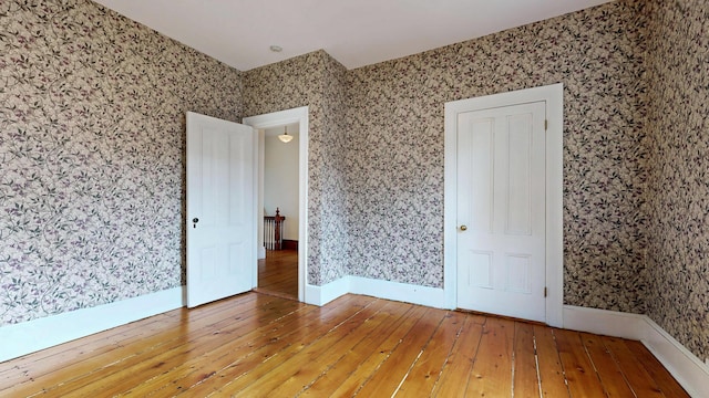 93 Fessenden St, Portland, ME 04103 - empty room with wallpapered walls and wood-type flooring