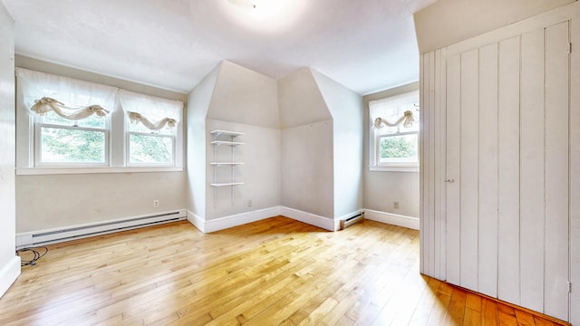 93 Fessenden St, Portland, ME 04103 - bonus room featuring a baseboard radiator, wood-type flooring, and lofted ceiling