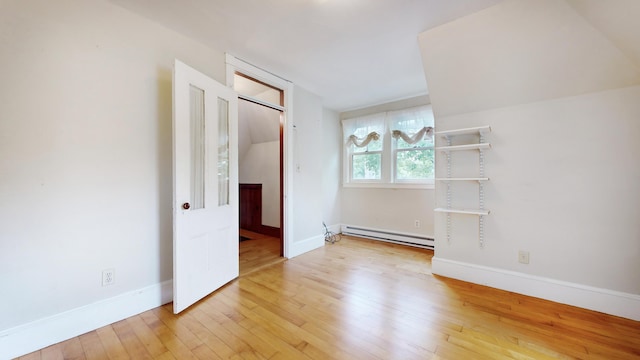 93 Fessenden St, Portland, ME 04103 - unfurnished room featuring a baseboard heating unit and wood-type flooring