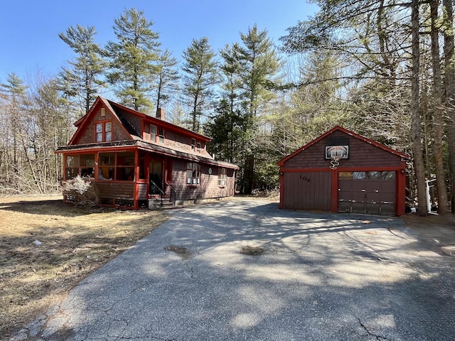106 S Belfast Ave, Augusta, ME 04330 - view of property exterior with a garage, driveway, and an outdoor structure