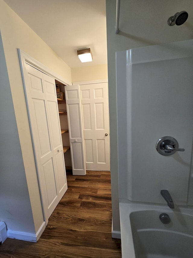 411 Augusta Rd, Belgrade, ME 04917 - bathroom featuring wood finished floors and  shower combination