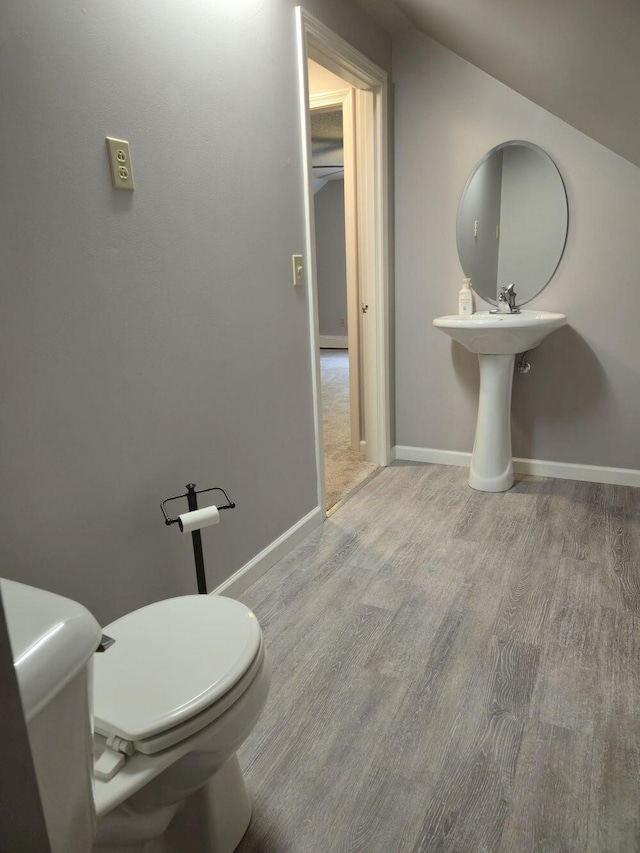411 Augusta Rd, Belgrade, ME 04917 - bathroom with wood finished floors and toilet