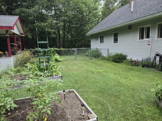 411 Augusta Rd, Belgrade, ME 04917 - view of yard featuring a garden and a gate