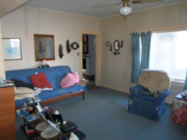 7 Clark St, Calais, ME 04619 - living area featuring carpet floors, ceiling fan, and ornamental molding