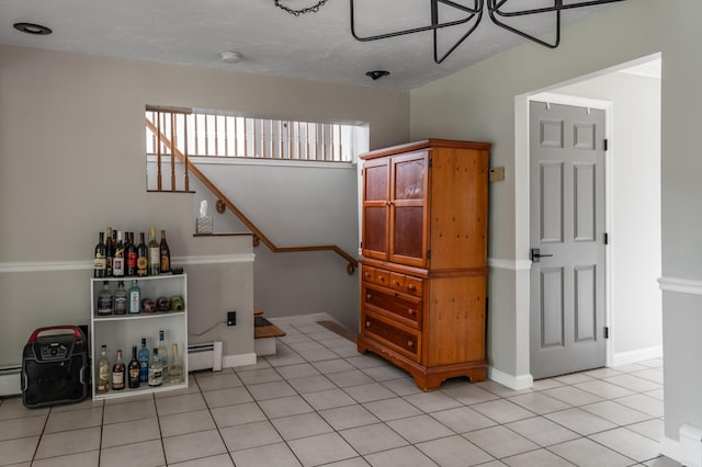 230 W Old Main Rd, Lowell, ME 04493 - stairs featuring a baseboard radiator and tile patterned floors