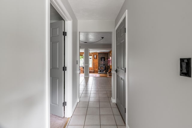 230 W Old Main Rd, Lowell, ME 04493 - hallway featuring light tile patterned floors and baseboards