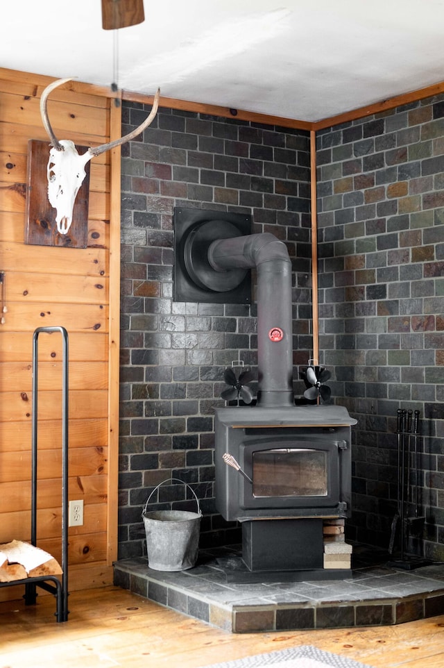 230 W Old Main Rd, Lowell, ME 04493 - detailed view of a wood stove and wood finished floors