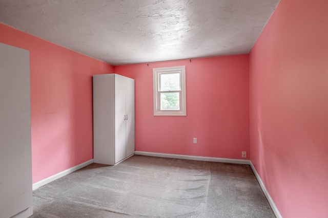 230 W Old Main Rd, Lowell, ME 04493 - spare room featuring carpet and a textured ceiling