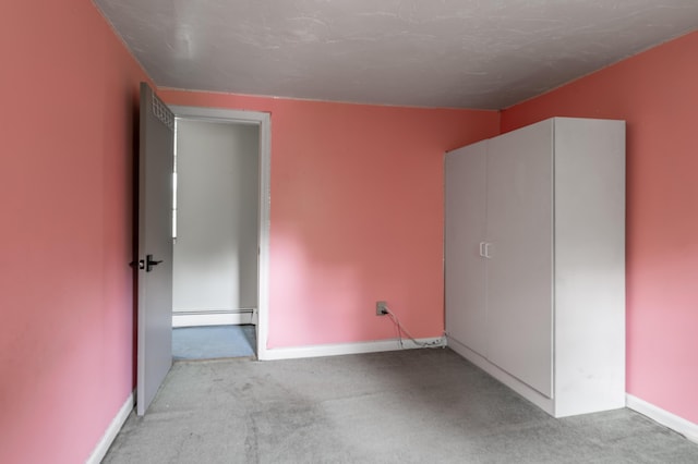 230 W Old Main Rd, Lowell, ME 04493 - unfurnished bedroom with carpet flooring and baseboard heating