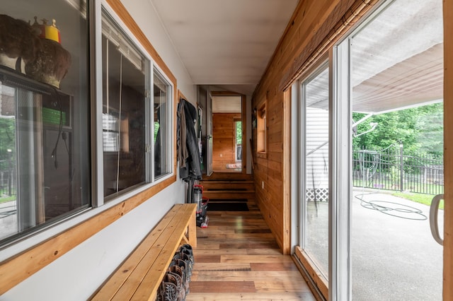 230 W Old Main Rd, Lowell, ME 04493 - unfurnished sunroom featuring wooden walls, healthy amount of natural light, and wood finished floors