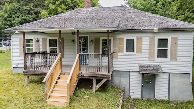 180 Lawrence St, Dover-Foxcroft, ME 04426 - view of front of property featuring a porch, a front yard, and a chimney