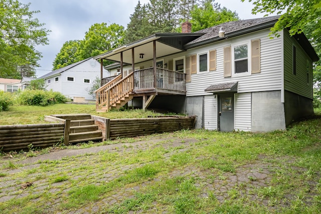 180 Lawrence St, Dover-Foxcroft, ME 04426 - rear view of property with stairway and a chimney
