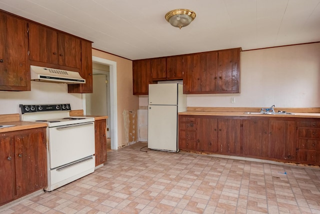 180 Lawrence St, Dover-Foxcroft, ME 04426 - kitchen with white appliances, under cabinet range hood, light countertops, brick patterned flooring, and brown cabinets