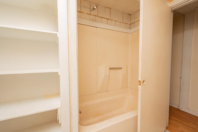 180 Lawrence St, Dover-Foxcroft, ME 04426 - bathroom with shower / tub combination and wood finished floors