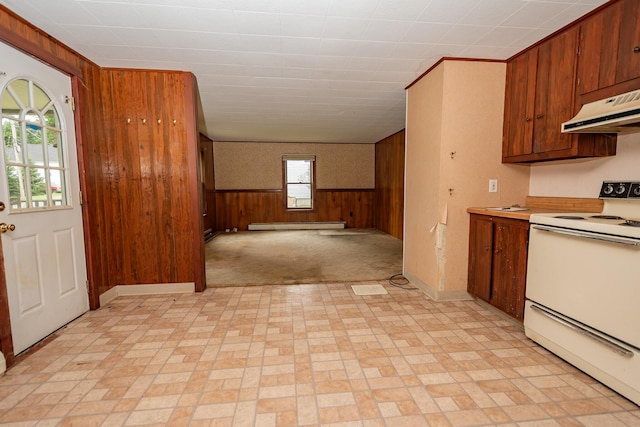 180 Lawrence St, Dover-Foxcroft, ME 04426 - kitchen featuring white electric range oven, under cabinet range hood, a baseboard radiator, wooden walls, and light countertops