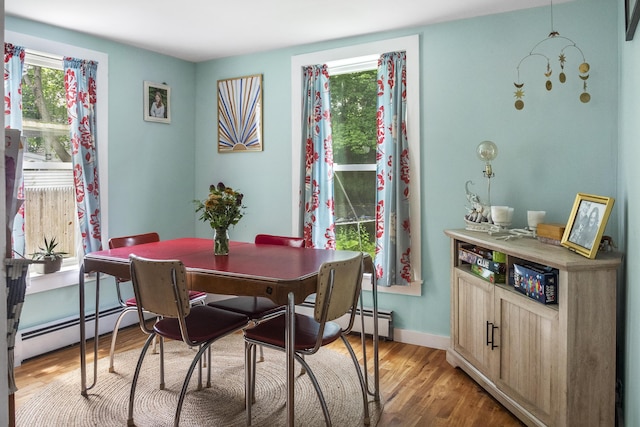 26 Wesley St Ct, Bath, ME 04530 - dining room featuring a baseboard heating unit and light wood-style flooring