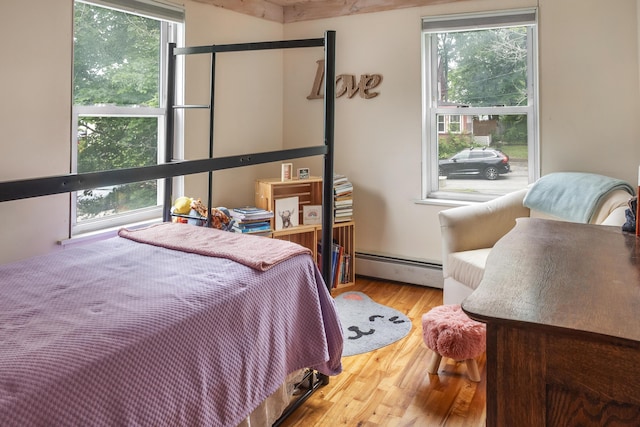 26 Wesley St Ct, Bath, ME 04530 - bedroom with a baseboard radiator and wood finished floors