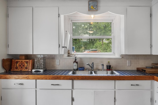 26 Wesley St Ct, Bath, ME 04530 - kitchen with white cabinetry and tasteful backsplash