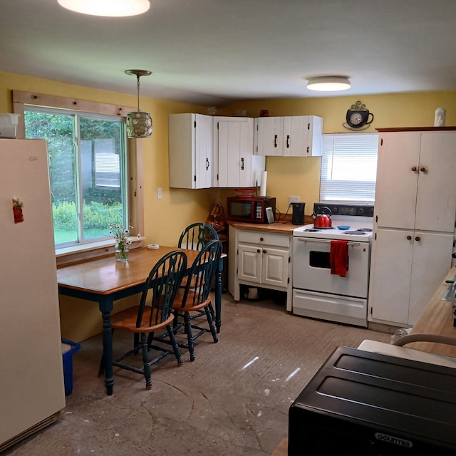 393 Lagrange Rd, Bradford, ME 04410 - kitchen with white appliances, white cabinets, and decorative light fixtures