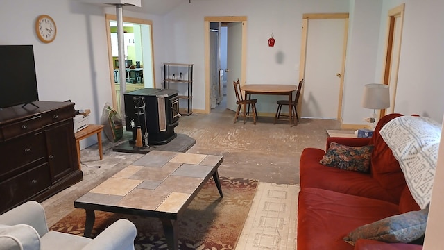 393 Lagrange Rd, Bradford, ME 04410 - living area with a wood stove and concrete flooring