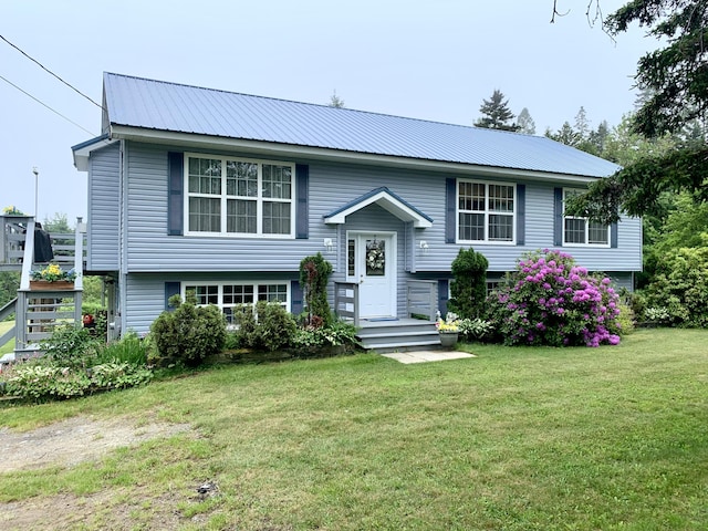 150 Leach Point Rd, Perry, ME 04667 - bi-level home with a front lawn and a metal roof