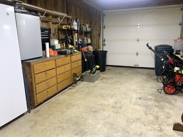150 Leach Point Rd, Perry, ME 04667 - garage featuring freestanding refrigerator