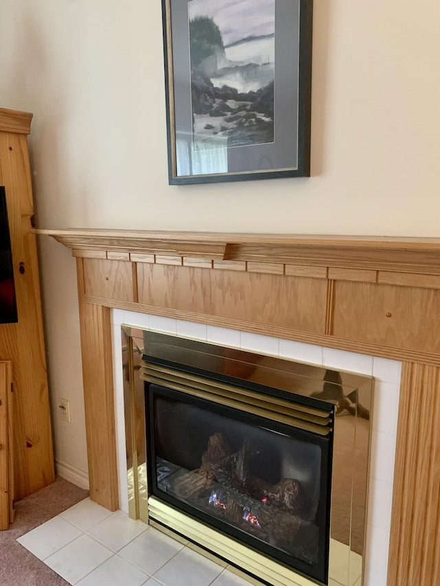 150 Leach Point Rd, Perry, ME 04667 - detailed view of a tiled fireplace and carpet flooring