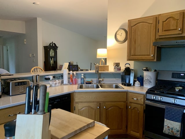 150 Leach Point Rd, Perry, ME 04667 - kitchen with stainless steel range with gas cooktop, under cabinet range hood, a peninsula, and light countertops