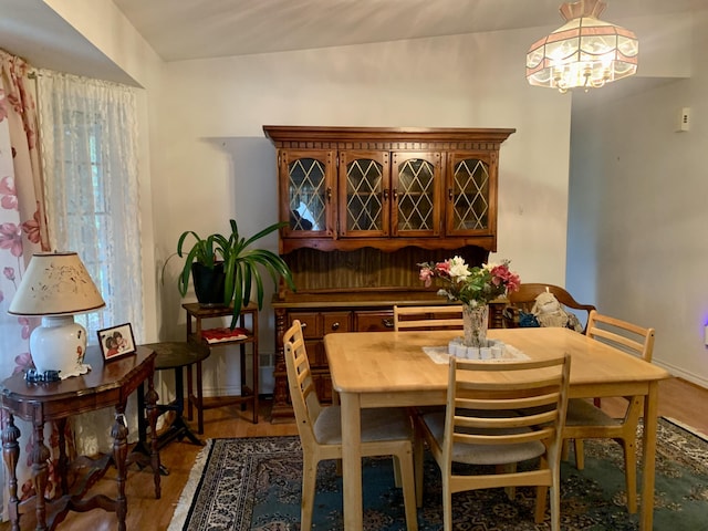 150 Leach Point Rd, Perry, ME 04667 - dining room featuring a chandelier and wood finished floors